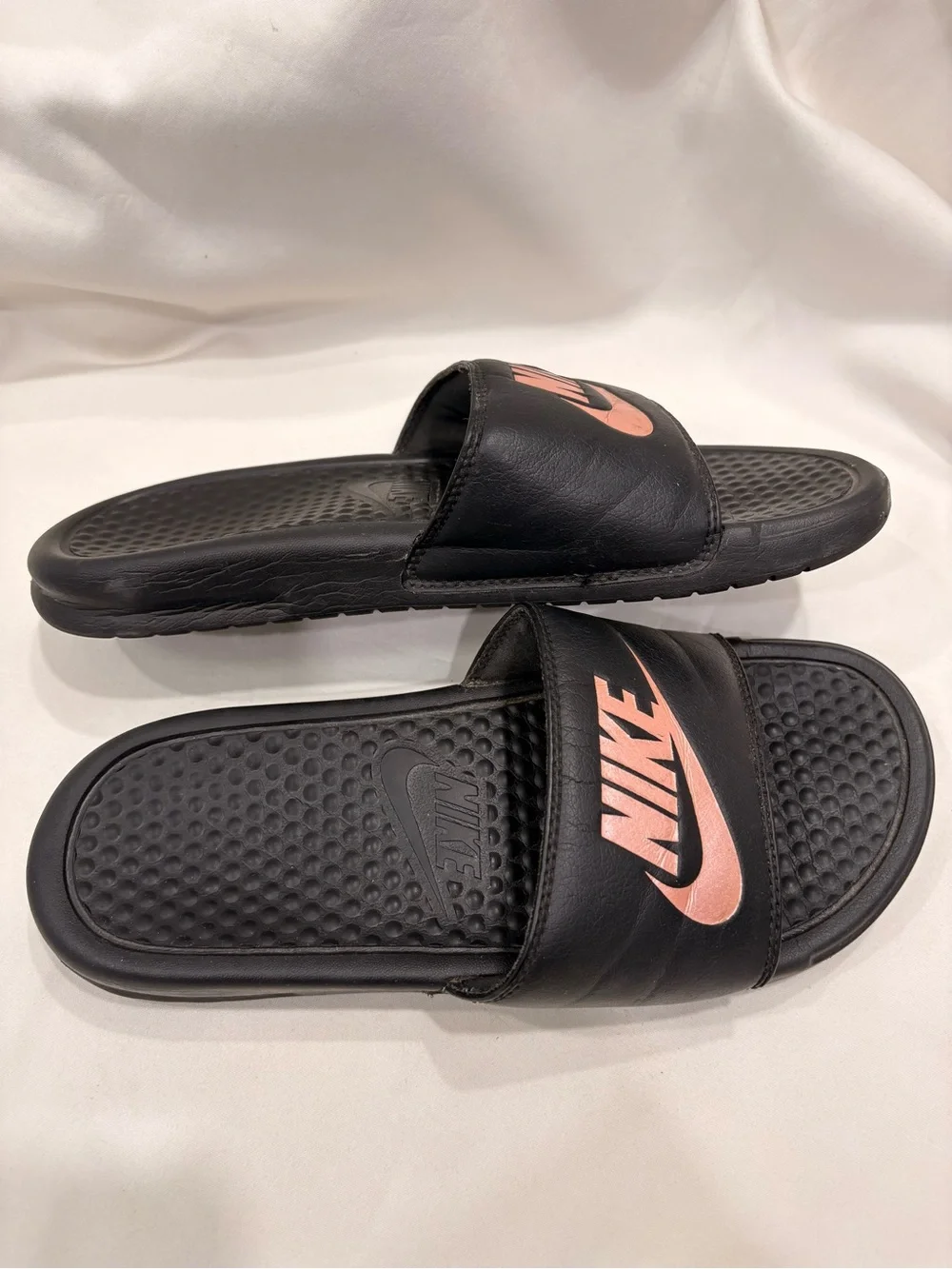 Woman’s Nike Benassi Black and Rose Gold Slides Size 7